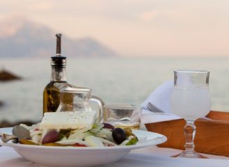 a-white-greek-salad-bowl-with-a-sea-view-background