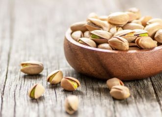raw-pistachios-in-a-brown-bowl